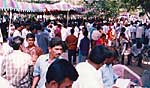Poor feeding crowd during Sri Ramana's Jayanti Celebration. Click to enlarge photo.